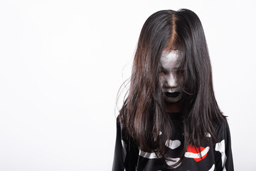 Asian little kid girl with face painting and hair covering face, woman child ghost or zombie horror...