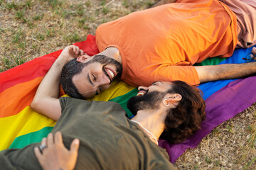 Happy couple with a pride flag. LGBT community