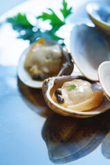 close up sea clams cooked with parsley