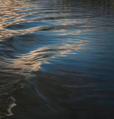 Abstract blurred nature background, river water surface and ripples
