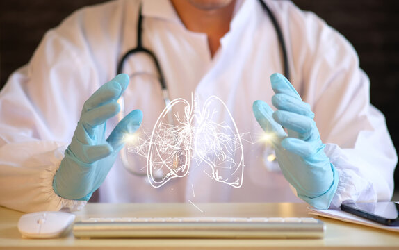 Doctor Examines The Hologram Of The Lung Tissue While Reviewing The Test Results On A Virtual Interface And Analyzing The Information. Future Medicine, Futuristic Technologies, And Pneumonitis.