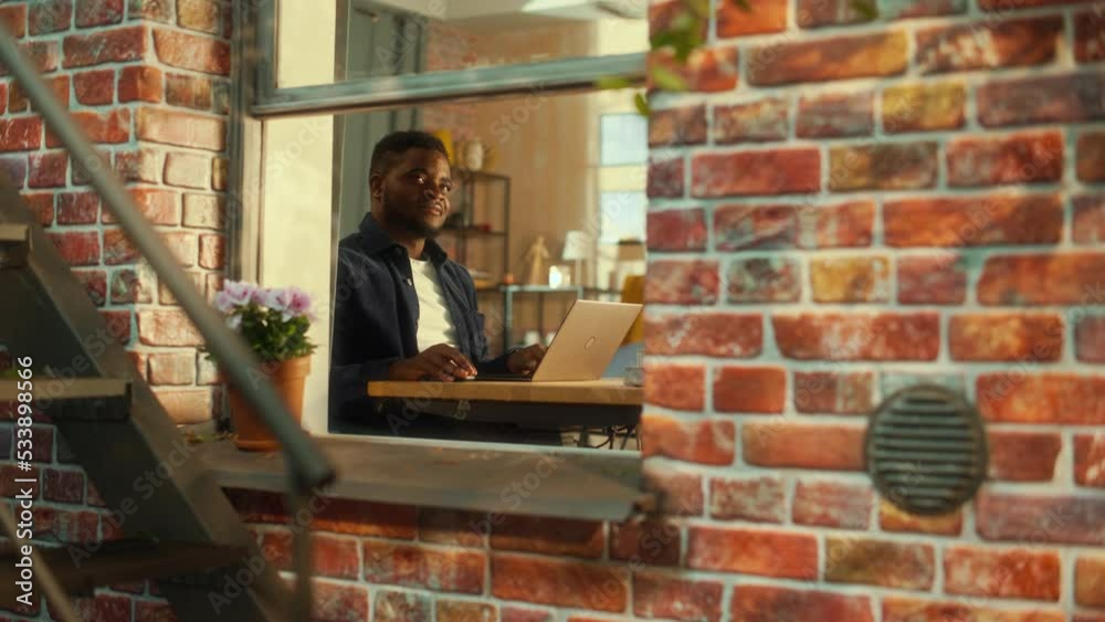 Fototapete young black man using laptop at home. doing inspirational remote work during the day. specialist wor