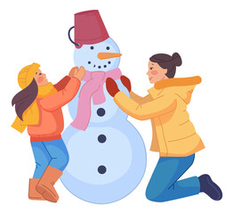 Mom making snowman with kid. Traditional winter activity