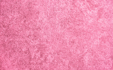 Background from decorative plaster with abstract patterns and stains. Fancy red and pink decoration wall texture, creative purple surface background. Finishing coating for building cladding.