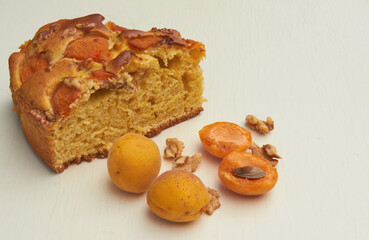 Apricot pie with fresh fruits on a wooden table. High quality photo