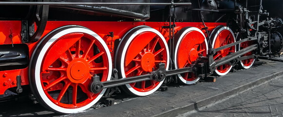 Locomotive wheels close-up in summer