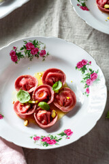 Beetroot ravioli with goat cheese, mozzarella, parmesan, butter sauce