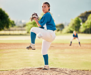 Baseball pitcher, ball sports and a athlete woman ready to throw and pitch during a competitive game or match on a court. Fitness, workout and exercise with a female player training outside on field - Powered by Adobe