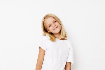 Fototapeta premium Portrait of a smiling little cutie hand gesture fun fashion on a light background