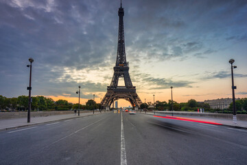 Eiffel Tower by the Seine River in Paris at sunrise. France
