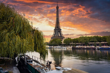 Eiffel Tower by the Seine River in Paris at sunrise. France - obrazy, fototapety, plakaty
