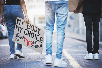 Body sign, abortion protest and people walking for legal justice, freedom of choice and support for...