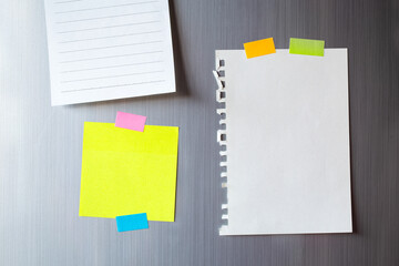 Abstract of Blank paper and stick paper on refrigerator door. paper note copy space for add text.