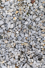 Pile of rubble top view. Top view of gravel or stone. Backdrop of the gray gravel cobblestones