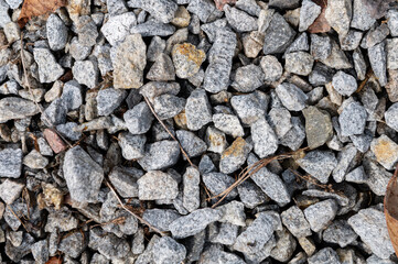 Pile of rubble top view. Top view of gravel or stone. Backdrop of the gray gravel cobblestones
