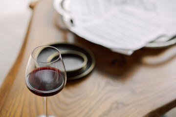 Glass of red wine on wooden table. High quality Glass of red wine on wooden tablephoto