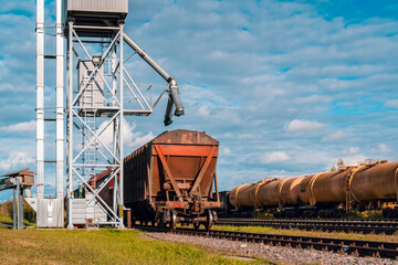 Back view of railway carriages with grain at grain elevator