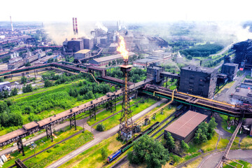 Fototapeta premium Factory chimney with burning flame