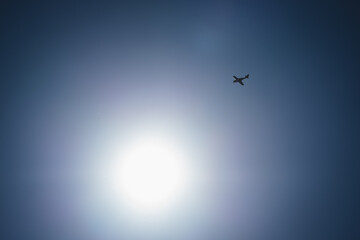 Fototapeta premium A single engine airplane flying into the sun. Austevoll, Norway.