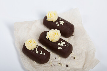 Cake potato. Decorated with butter cream. On a white background. Shot close-up.