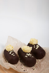 Cake potato. Decorated with butter cream. On a white background. Shot close-up.
