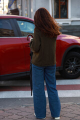 Slim woman from the back in the street