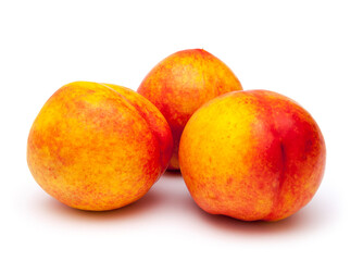 Fototapeta na wymiar Three whole peaches