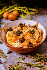 broken eggs with black pudding
