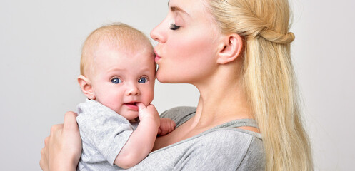 Mother and baby playing and smiling. Happy family.