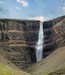 Hengifoss, 128 meters, in Fljótsdalshreppur, East Iceland. Surrounded by basaltic strata...