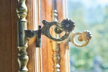 The handle of an old window in a palace or an old mansion.