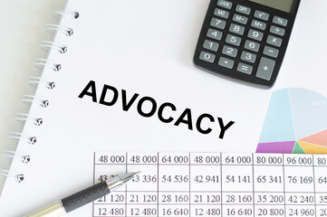 Text ADVOCACY on financial tables, the working paper . Business and financial conzept.