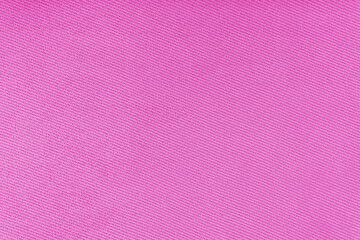Texture of natural fabric or cloth. Fabric texture diagonal weave of natural cotton or linen textile material. Pink canvas background. Decorative fabric for curtain, furniture, walls, clothes