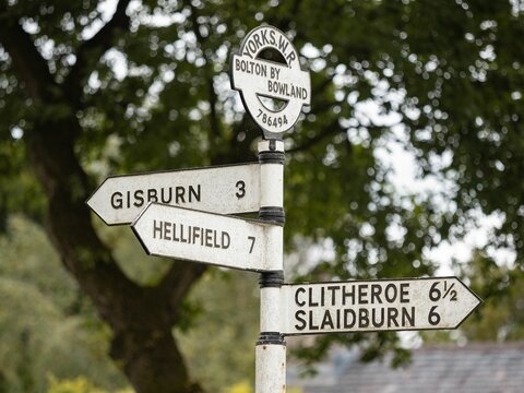 old fashioned town direction sign