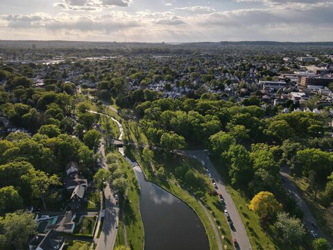 Fototapeta Aerial shot of the Clifton Park in New York City with the sun shining in the background