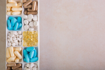 plastic container with pills on white background