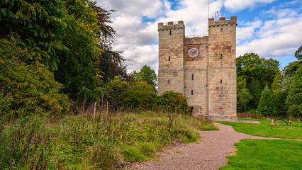 Fototapeta na wymiar Path to Preston Pele Tower, which is a 14th century bastle of medieval construction located in Northumberland near the coast and was a fortified dwelling for protection against the Border Reivers