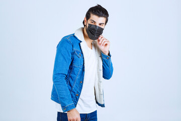 Man wearing black mask and preventing corona virus