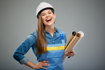 Woman builder in safety helmet holding blueprints rolls. Isolated female portrait. - 533946732