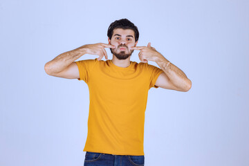 Man with beard pointing at her smile