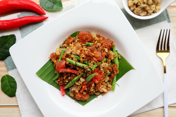 Pad Prik king - Stir fried deep fried catfish with curry paste , Thai food called Pad Prik King Pla dook foo at top view 