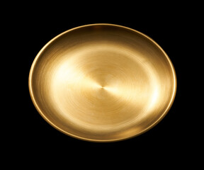 Top view of golden plate isolated on black background.