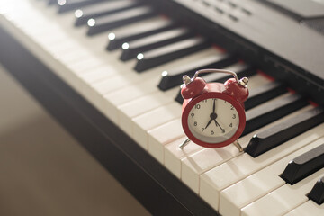 alarm clock on piano, synthesizer