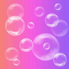 Transparent realistic soap bubbles on bright background