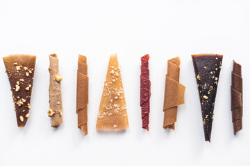 Natural and healthy snack food - fruit pastille from apples, raspberry and currant on a white background. Fruit Marshmallow