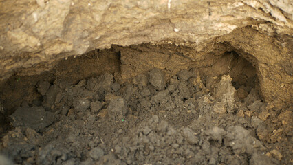 Erosion hole pit damage field subsoil tractor track hole pit soil inappropriately managed earth...