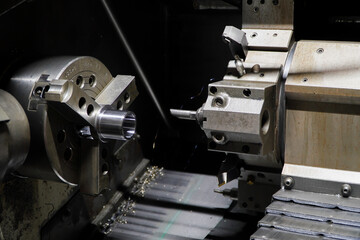 metal machine tools industry.turret head in black for setting various drill bits.The hi-technology metal working process by CNC turning machine.