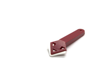 Plastic spatula for corners with a rubber pad for silicone