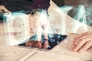 Double exposure of man's hand holding and using a digital device and data theme drawing. Technology concept.