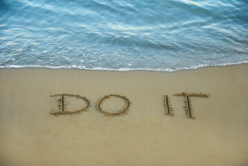 Do it written in the sand on the beach with the sea washing up the shore